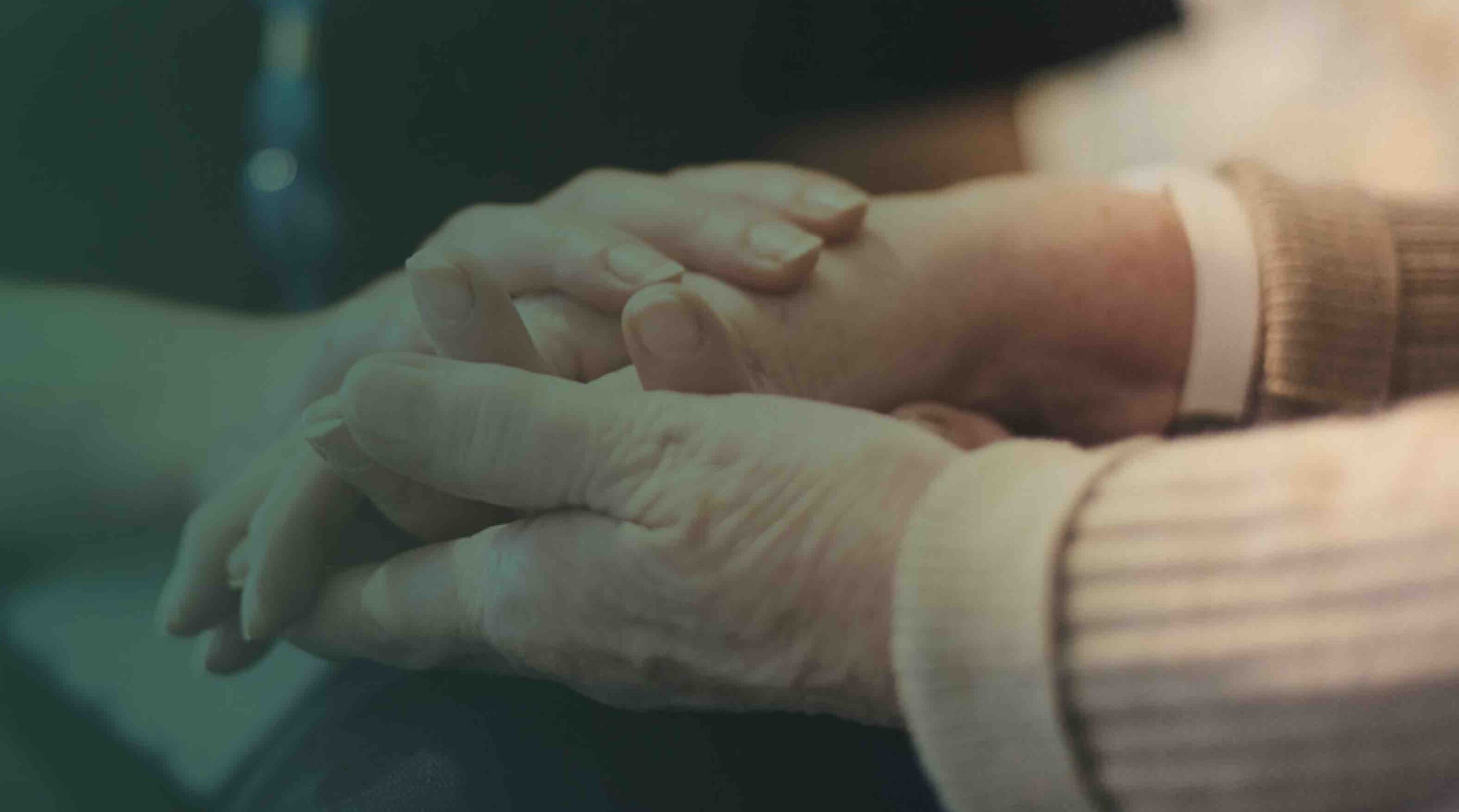 Two people holding hands.