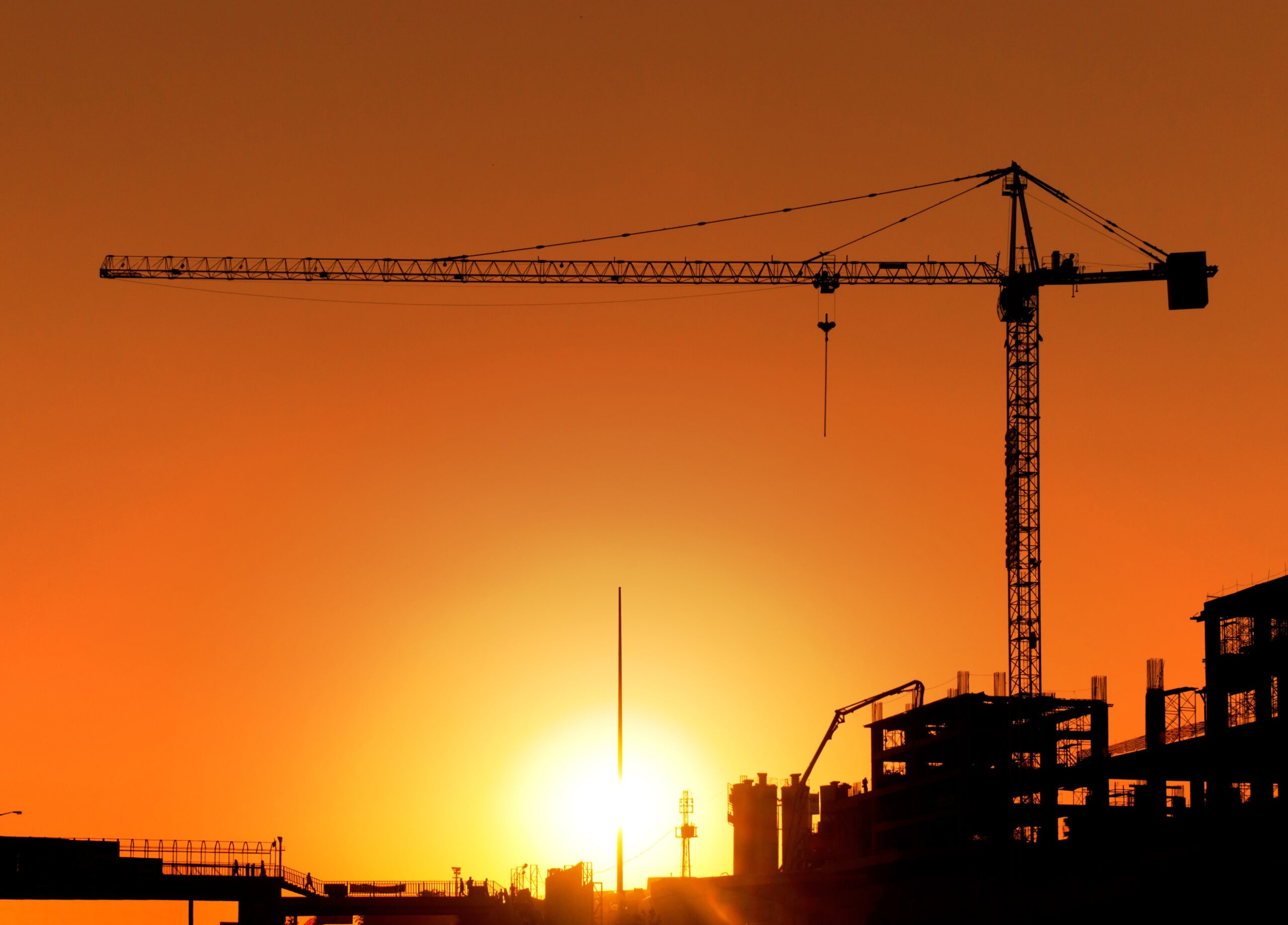 A sunset over a construction site.