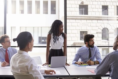 Employees in a meeting room.