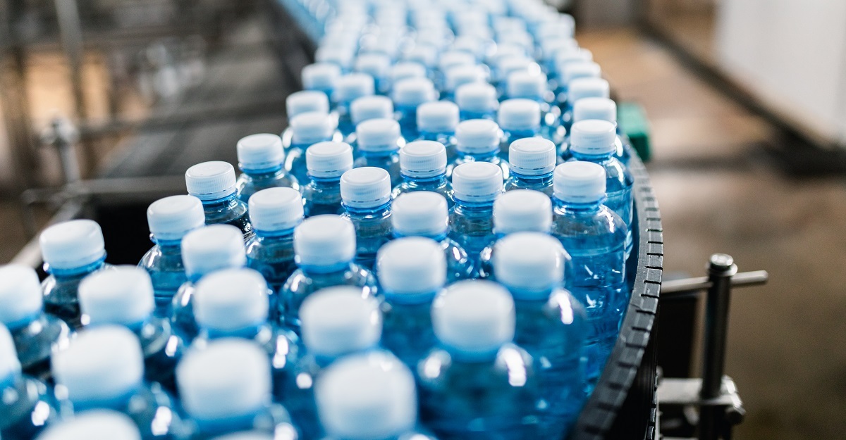 Plastic water bottles on a conveyor.