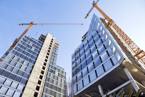 Modern skyscrapers under construction.